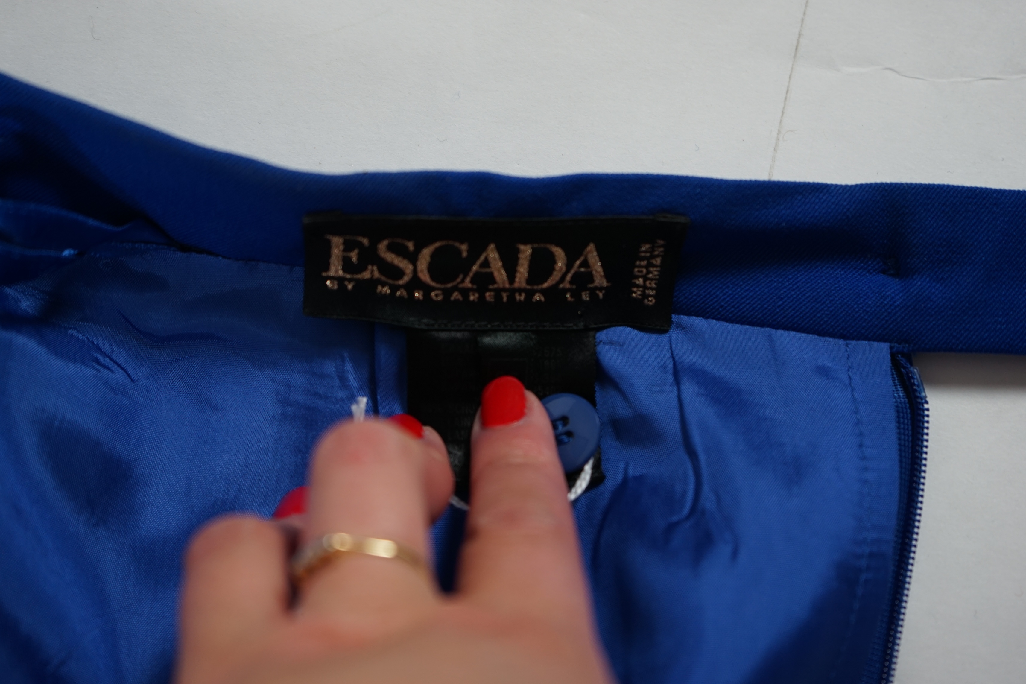 Two Escada skirts and a multi colour silk body blouse. Proceeds to Happy Paws Puppy Rescue